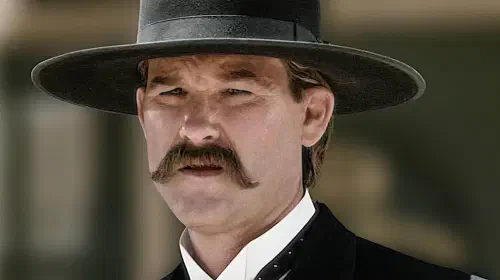 assets/kurt-russell-as-wyatt-warp-as-he-squints-in-the-sun-in-tombstone.jpeg