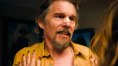 assets/ethan-hawke-is-looking-at-someone-in-the-lowdown.jpeg