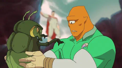 assets/allen-the-alien-grossed-out-as-he-holds-a-sinlack-beetle-while-omni-man-stands-in-the-background-in-invincible-season-4.jpeg