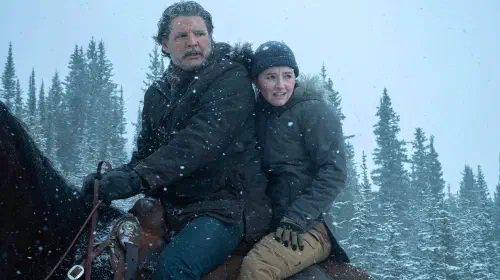 assets/joel-and-abby-riding-a-horse-during-a-snowstorm-in-the-last-of-us-season-2.jpeg