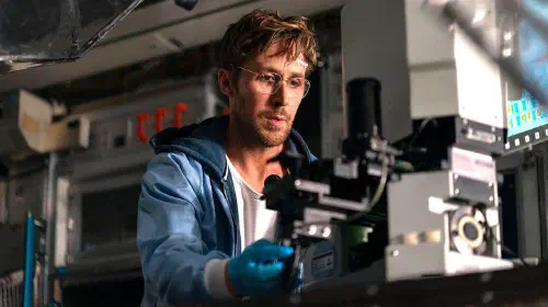 assets/ryan-gosling-as-ryland-looking-at-a-microscope-in-project-hail-mary.jpeg