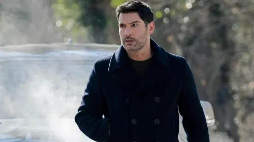 assets/tom-ellis-colin-looking-intense-while-standing-in-front-of-a-car-in-cia.jpeg