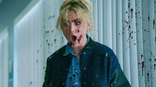assets/kathryn-newton-screaming-while-covered-in-blood-in-ready-or-not-2-here-i-come.jpeg