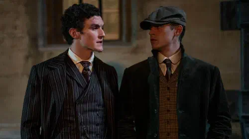 assets/hero-fiennes-tiffin-as-sherlock-holmes-and-do-nal-finn-as-james-moriarty-speaking-in-young-sherlock.jpeg