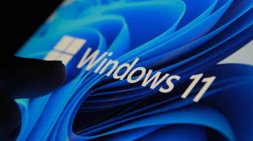 assets/Finger-touching-Windows-11-logo-on-screen-in-dark-room.jpeg