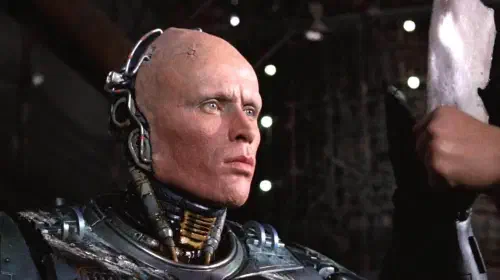 assets/robocop-peter-weller-removes-his-helmet-to-look-at-alex-murphy-s-reflection-in-robocop.jpeg