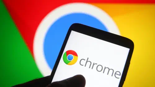 assets/Chrome-logo-on-phone-in-front-of-larger-Chrome-display-in-background-2.jpeg