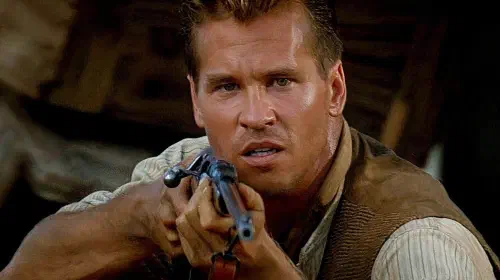 assets/val-kilmer-as-colonel-patterson-aiming-his-rifle-at-a-lion-in-the-ghost-and-the-darkness.jpeg