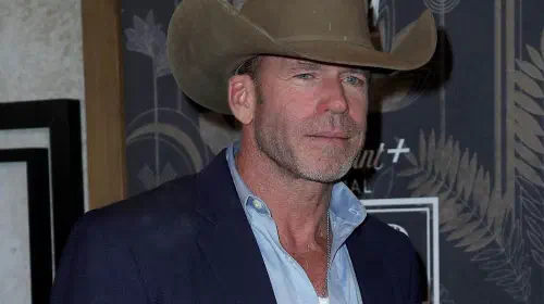 assets/taylor-sheridan-wearing-a-cowboy-hat-at-a-1923-event.jpeg