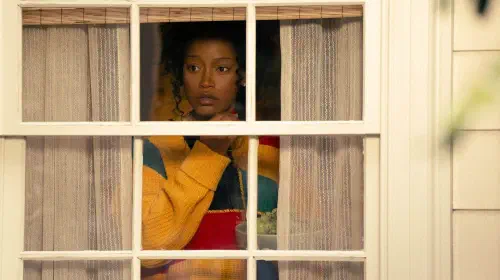 assets/keke-palmer-looking-out-a-window-in-the-burbs.jpeg