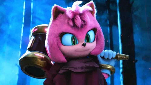 assets/amy-smiling-while-holding-her-hammer-in-a-forest-in-sonic-the-hedgehog-3.jpeg