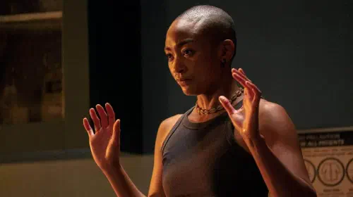 assets/nora-with-her-hands-up-in-the-last-of-us.jpeg