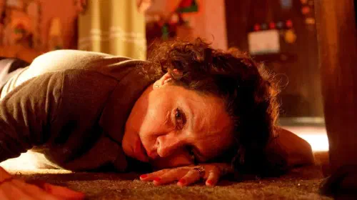 assets/vero-nica-falco-n-as-carmen-santiago-lying-on-the-floor-in-lee-cronin-s-the-mummy.jpeg