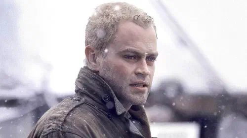 assets/neal-mcdonough-as-first-lieutenant-buck-compton-in-band-of-brothers-2001.jpeg