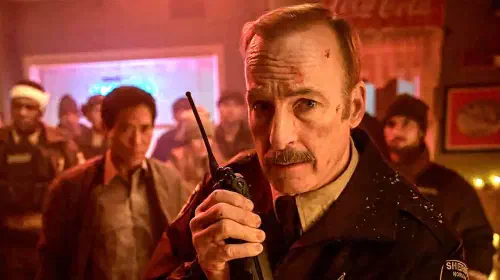 assets/bob-odenkirk-s-sheriff-ulysses-holding-a-walkie-talkie-looking-worried-in-normal.jpeg
