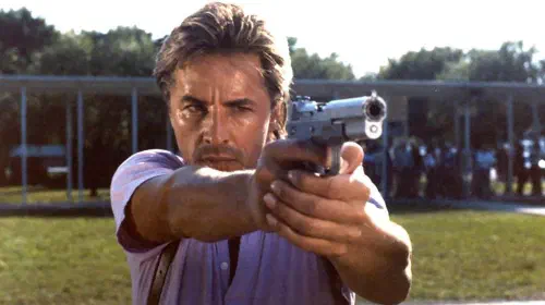 assets/don-johnson-s-crockett-aiming-a-gun-in-miami-vice.jpeg
