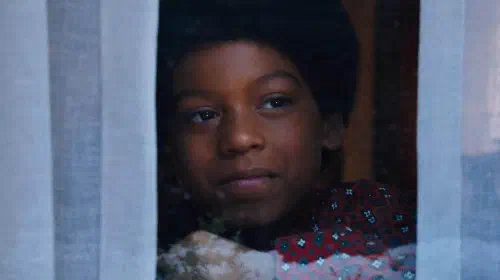 assets/young-michael-jackson-looking-out-the-window-in-michael.jpeg