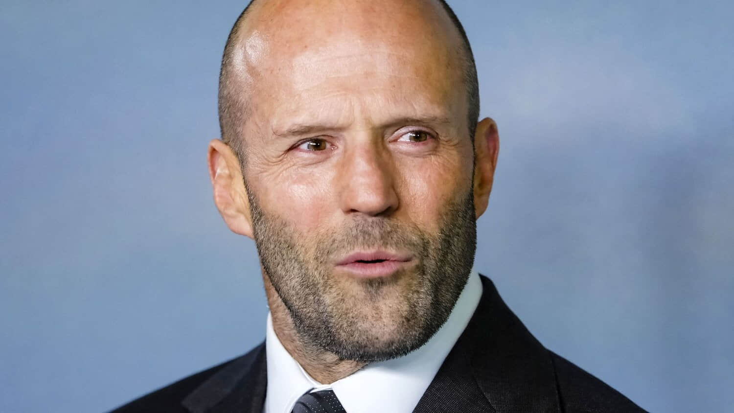jason-statham-looking-intrigued-on-a-red-carpet.jpeg