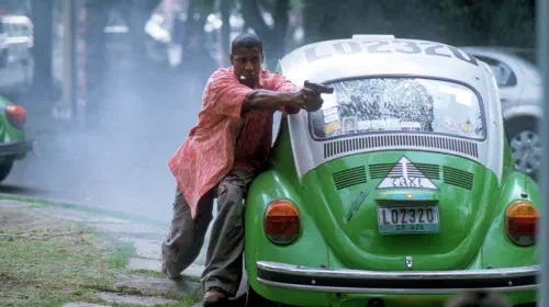 assets/denzel-washington-as-john-creasy-aiming-a-gun-in-man-on-fire.jpeg