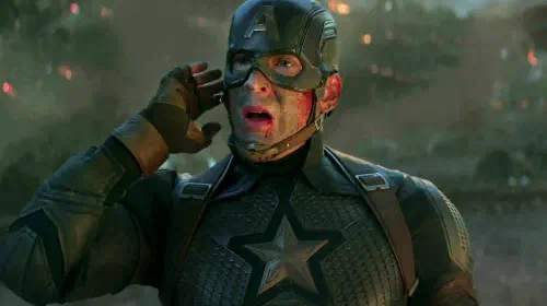 assets/chris-evans-captain-america-getting-a-call-with-his-arm-flexed-in-avengers-endgame.jpeg