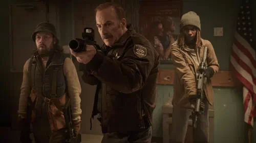assets/brendan-fletcher-bob-odenkirk-reena-jolly-holding-guns-in-normal.jpeg