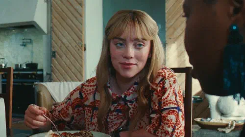 assets/billie-eilish-smirking-in-swarm.jpeg