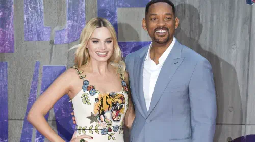 assets/margot-robbie-and-will-smith-posing-on-the-red-carpet-for-suicide-squad.jpeg