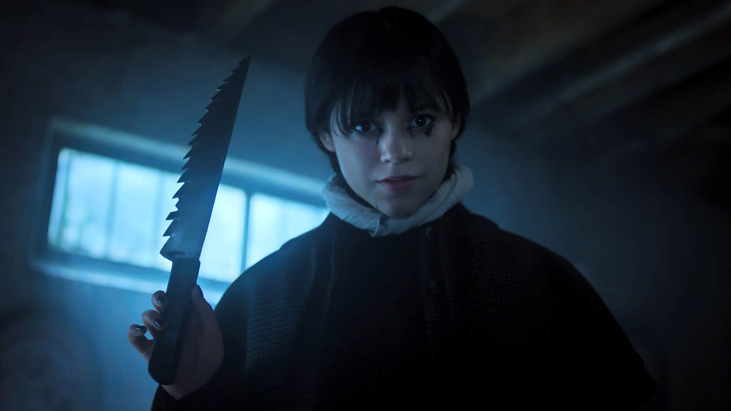 wednesday-holding-a-knife.jpeg