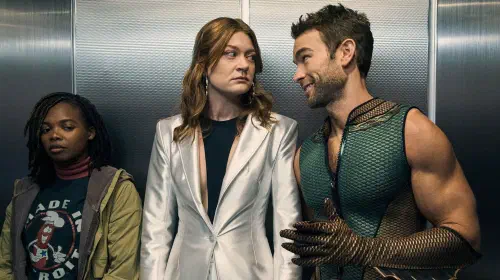 assets/the-deep-and-ashley-looking-at-each-other-inside-an-elevator-while-sister-sage-stands-beside-them-in-the-boys.jpeg