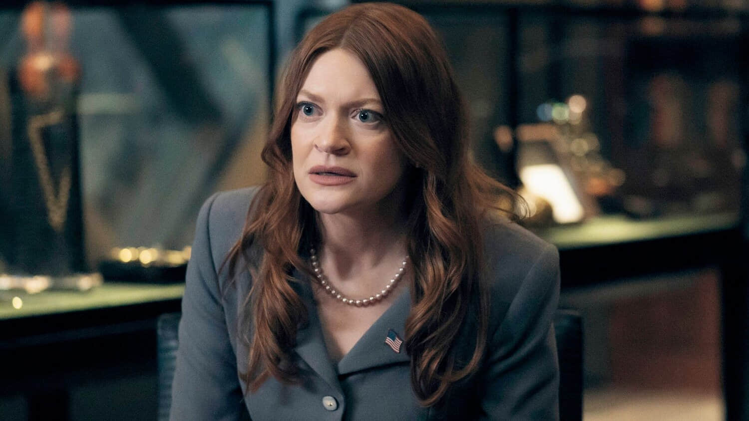 ashley-sitting-down-and-looking-concerned-inside-a-vought-office-in-the-boys-season-5.jpeg