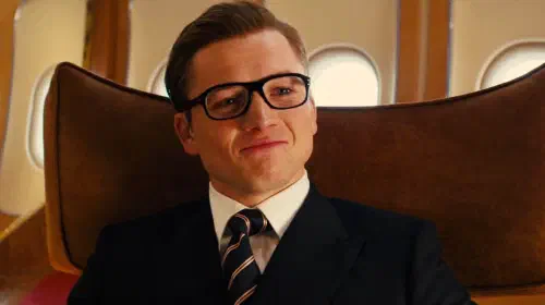 assets/taron-egerton-smiling-as-eggsy-in-kingsman-the-golden-circle-1.jpeg