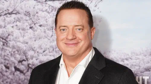 assets/brendan-fraser-smiling-at-the-rental-family-red-carpet.jpeg