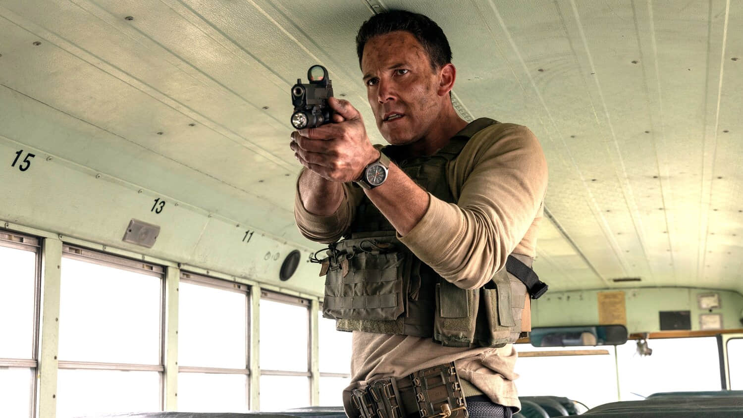 ben-affleck-s-christian-looking-intensely-while-aiming-his-pistol-in-a-bus-in-the-accountant-2.jpeg