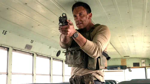 assets/ben-affleck-s-christian-looking-intensely-while-aiming-his-pistol-in-a-bus-in-the-accountant-2.jpeg