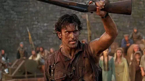 assets/bruce-campbell-holding-up-a-shotgun-as-ash-in-army-of-darkness.jpeg