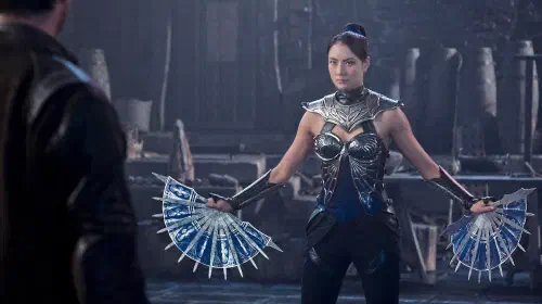 assets/kitana-brandishing-her-blade-fans-against-johnny-cage-in-mortal-kombat-ii-1.jpeg