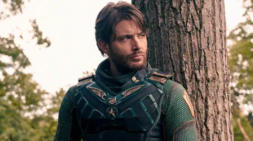 assets/jesnen-ackles-posted-up-near-a-tree-as-soldier-boy-in-the-boys.jpeg