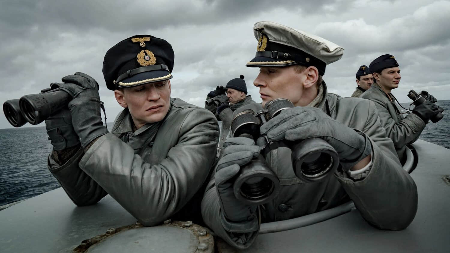 ww2-soldiers-stand-out-of-a-porthole-of-a-submarine-in-das-boot-show.jpeg