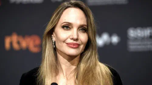 assets/angelina-jolie-smiling-while-on-a-conference-at-the-san-sebastian-international-film-festival.jpeg