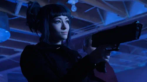 assets/jodelle-ferland-as-five-holds-up-a-gun-in-blue-lighting-in-the-2015-show-dark-matter.jpeg