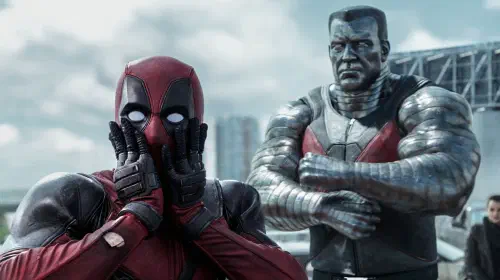 assets/deadpool-looks-shocked-while-colossus-stands-behind-him-angrily-in-the-first-deadpool-movie.jpeg