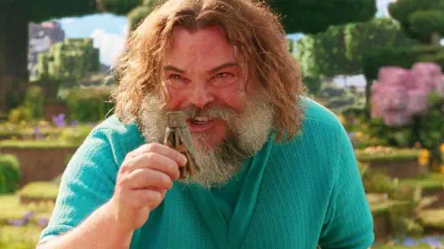 assets/jack-black-as-steve-excitedly-holding-up-a-small-object-in-a-minecraft-movie-2025.jpeg