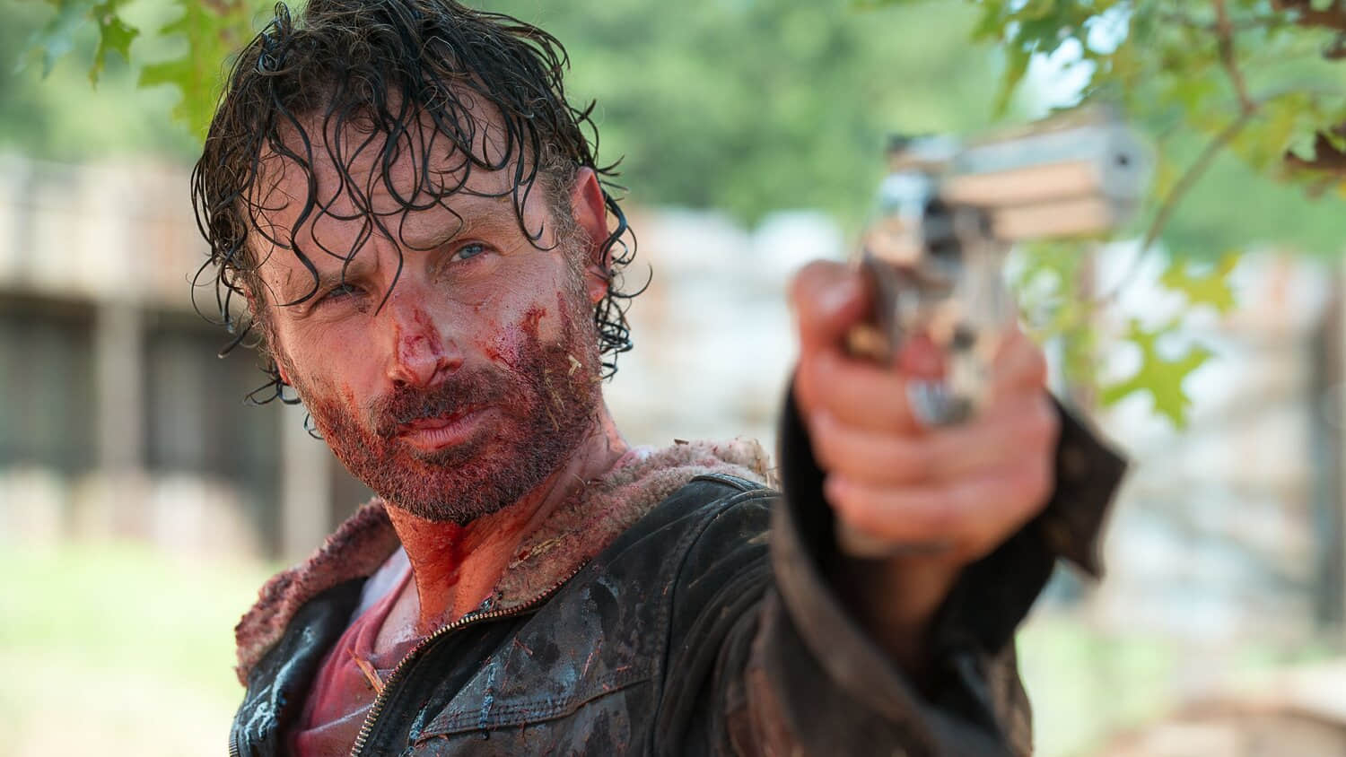 close-up-of-a-sweaty-rick-grimes-wielding-a-handgun-in-the-walking-dead.jpeg