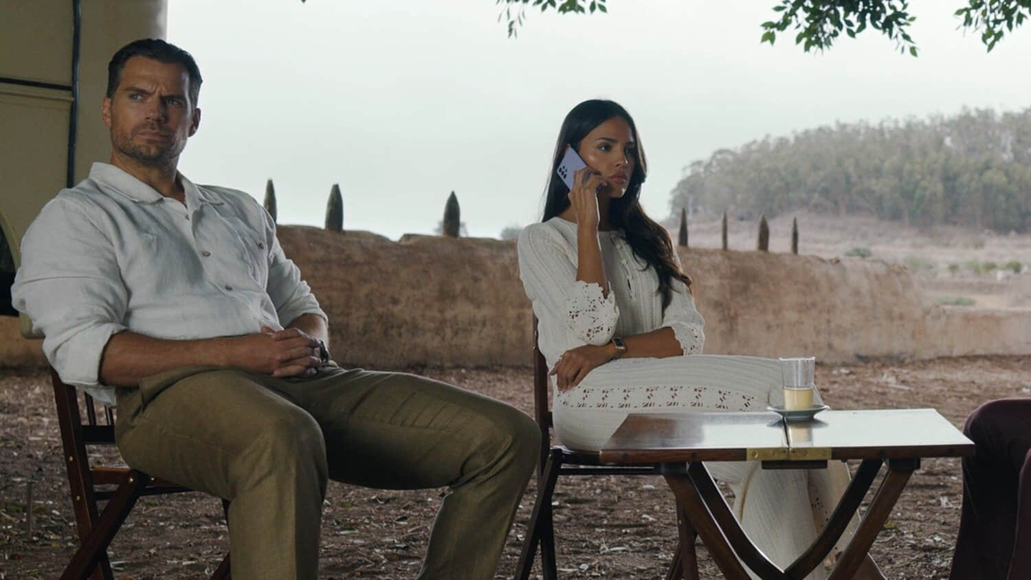 henry-cavill-staring-while-eiza-gonzalez-is-making-a-phone-call-in-in-the-grey.jpeg
