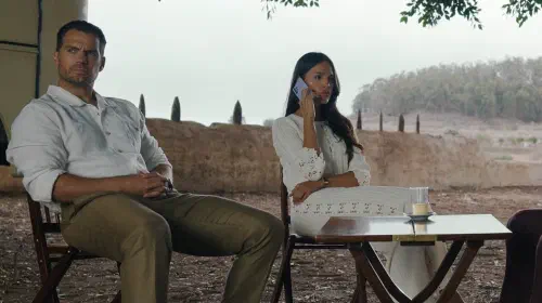 assets/henry-cavill-staring-while-eiza-gonzalez-is-making-a-phone-call-in-in-the-grey.jpeg