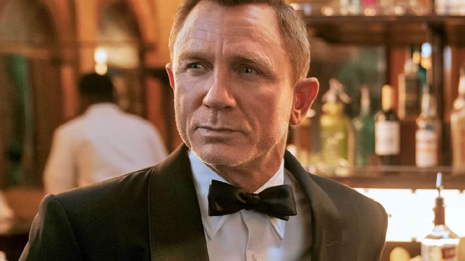 daniel-craig-as-james-bond-at-a-bar-in-no-time-to-die.jpeg