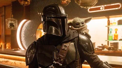 assets/mandalorian-with-grogu-on-shoulder-1.jpeg
