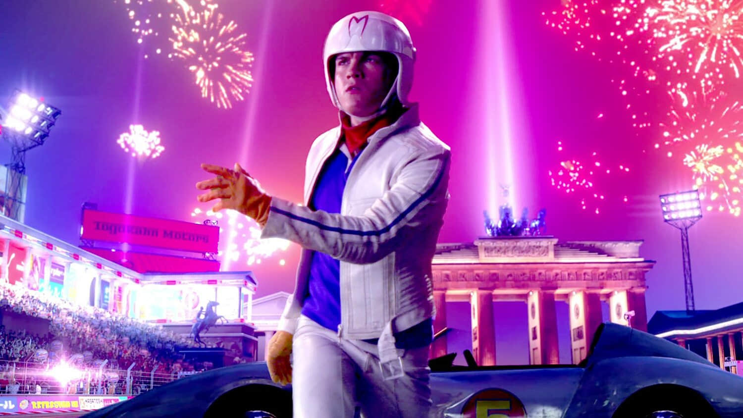 emile-hirsch-s-speed-posing-in-front-of-the-mach-5-in-speed-racer.jpeg