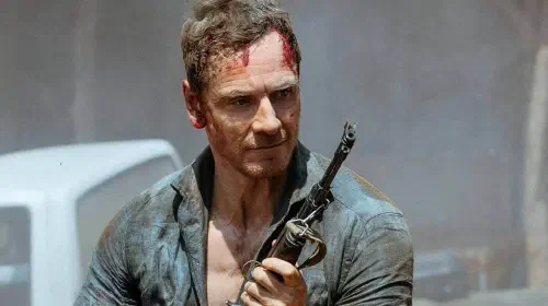 assets/michael-fassbender-with-rifle-in-the-agency.jpeg