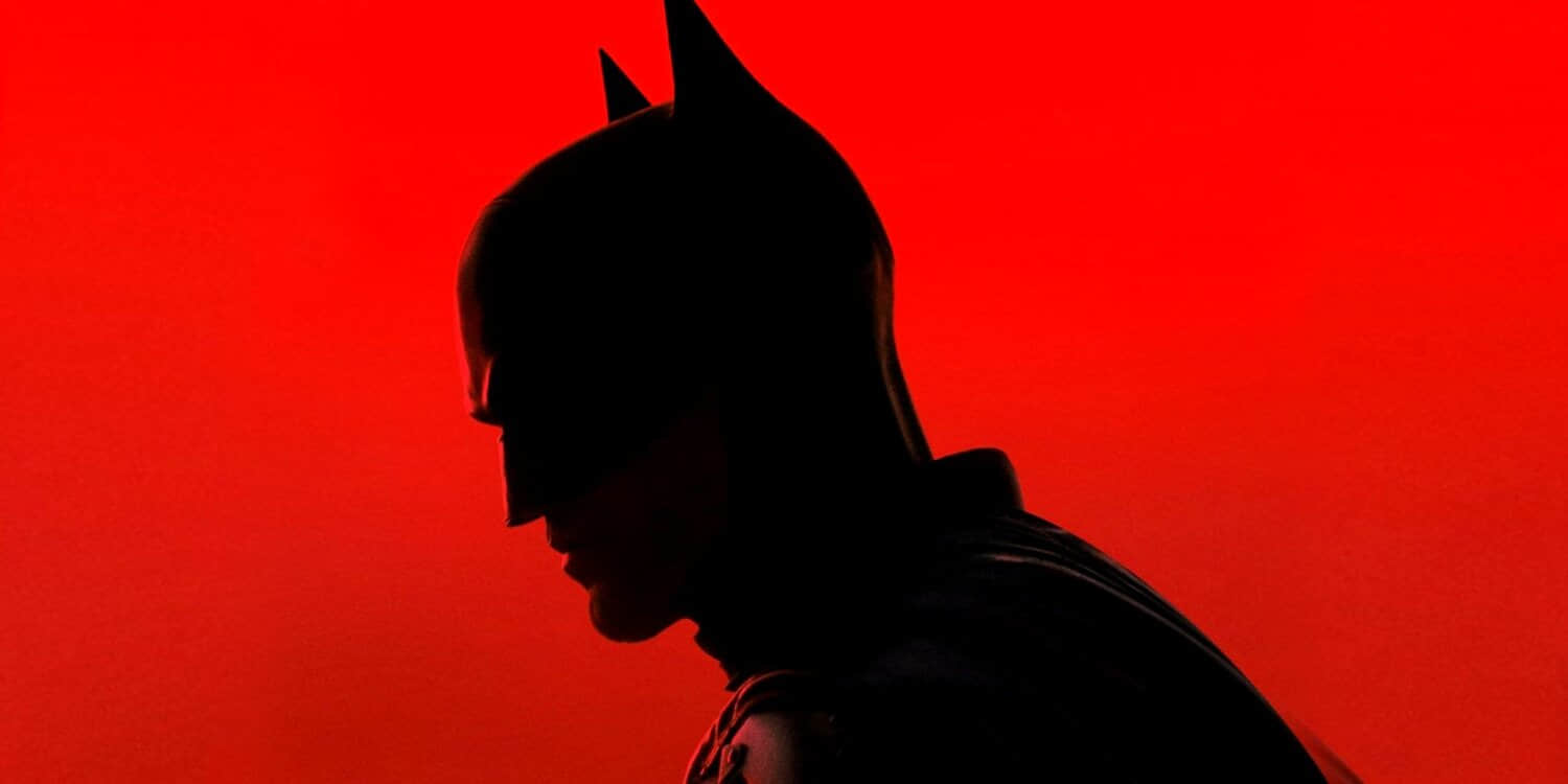 robert-pattinson-s-dark-knight-stands-in-front-of-a-red-background-in-the-batman.jpeg
